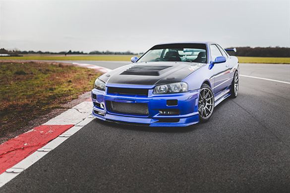 The Fast & Furious Nissan R34 GT-R Driven By Paul Walker Sells For Record  $1.4M